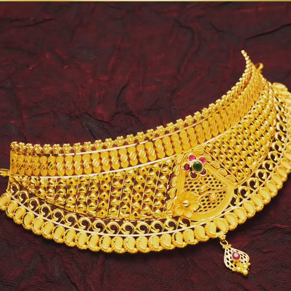 Wide filigree choker necklace with a peacock motif and a small hanging drop