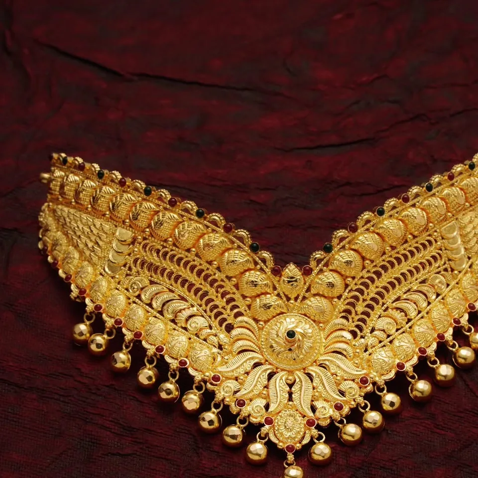 V-shaped filigree choker with floral centre and bead fringe