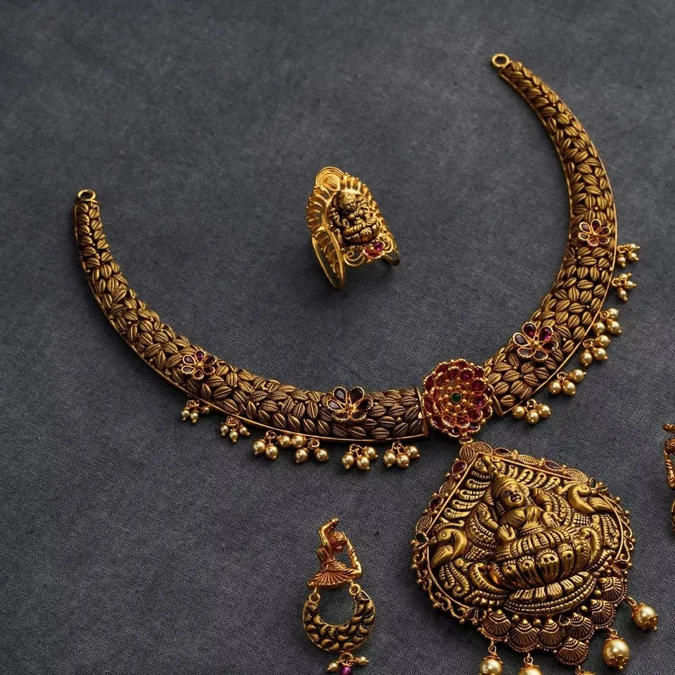 Antique-finish collar necklace with Lakshmi pendant, earrings and ring