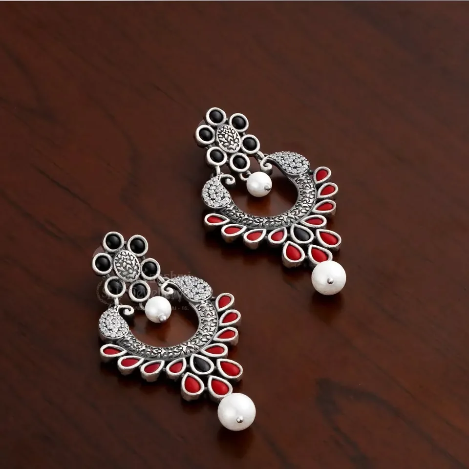 Silver-tone chandbali earrings with red and black stones and pearl drops