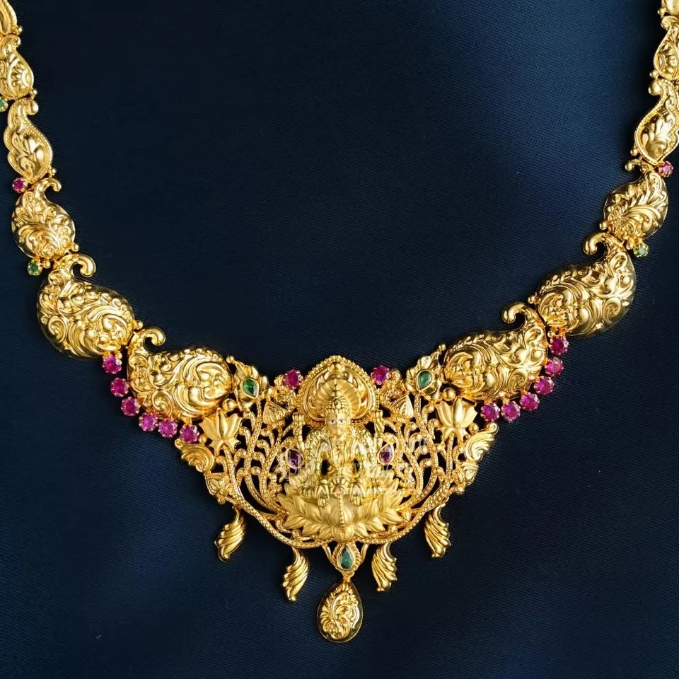 Temple necklace with Goddess Lakshmi centrepiece and pink stone accents